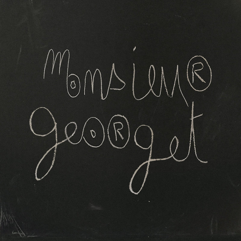 Handwritten text 'Monsieur George' on a dark background