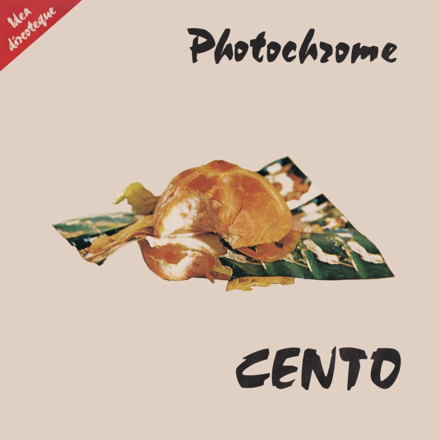 Cento Photochrome vinyl record cover. A minimalist design featuring a photo of a sandwich on a napkin against a beige background. The band name "Cento" and album title "Photochrome" are written in black script.