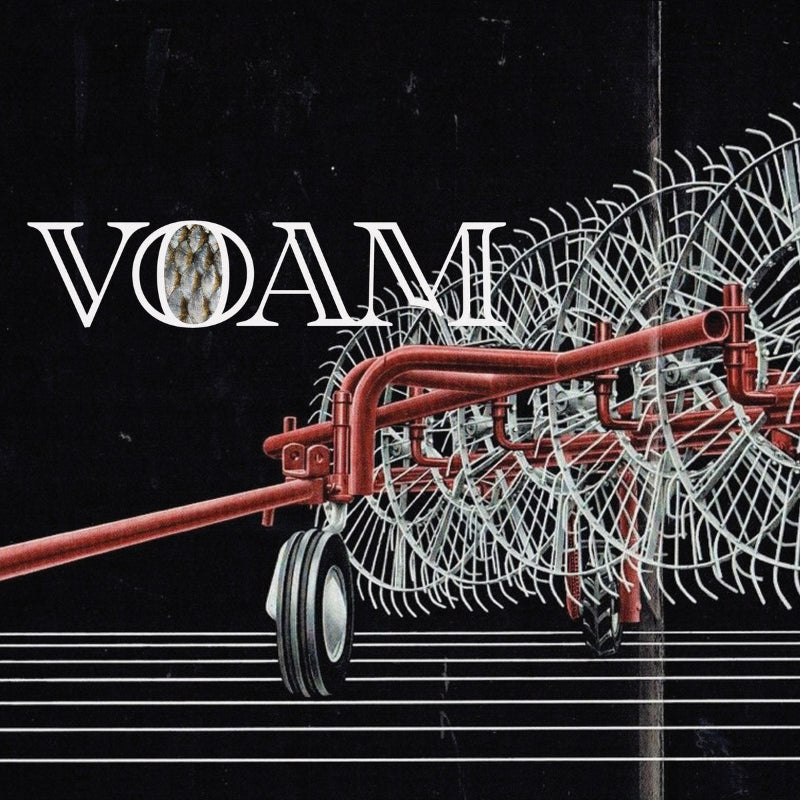 Red agricultural implement with 'VOAM' branding on a black background
