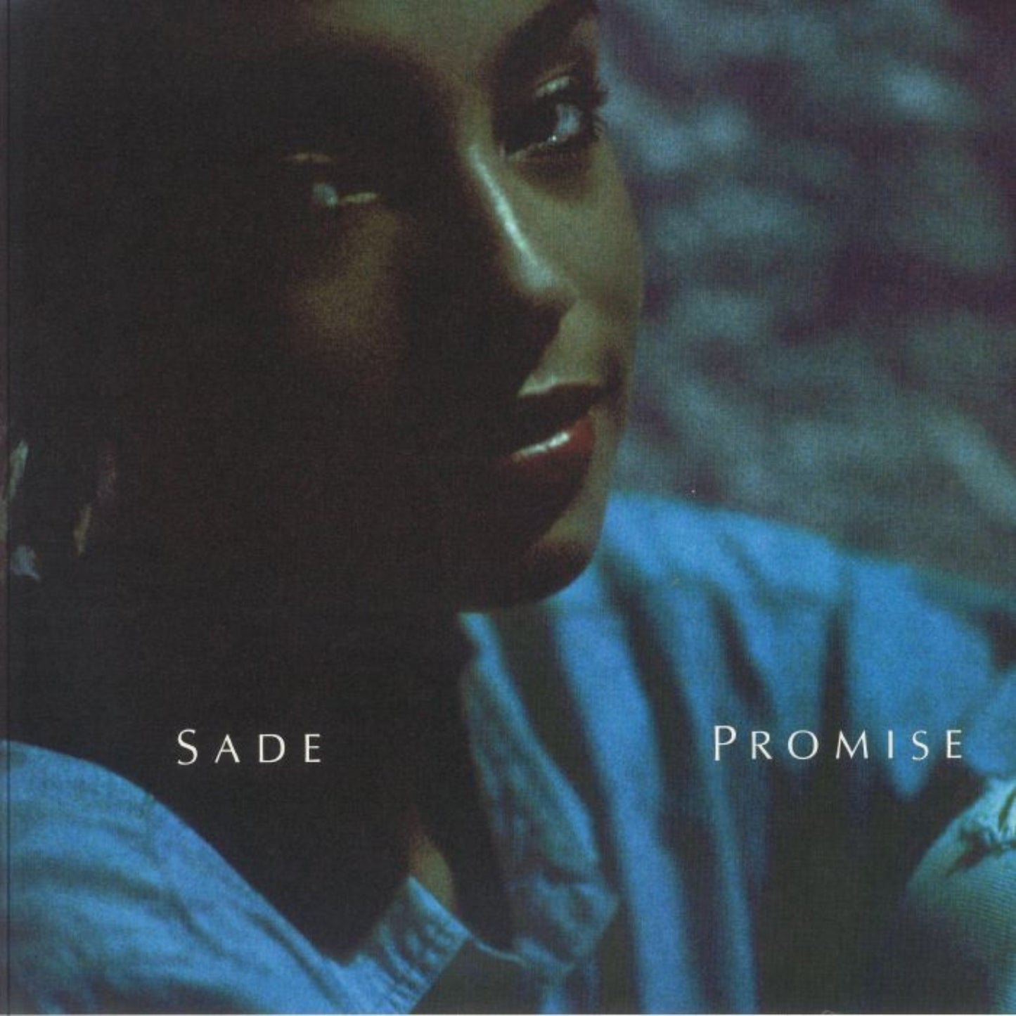 Sade Promise vinyl record front cover. A classic R&B album cover featuring Sade Adu's portrait and the album title in elegant typography