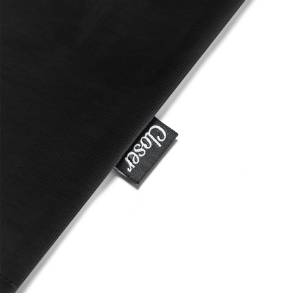 Black fabric with a 'Coser' brand tag on a white background