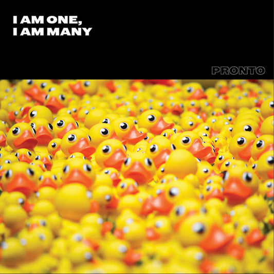 Multiple yellow rubber ducks with a black banner at the top displaying 'I AM ONE, I AM MANY' and the brand 'PRONTO'.