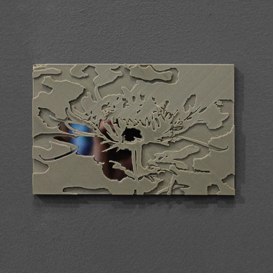 Decorative wall art with floral design on a gray background