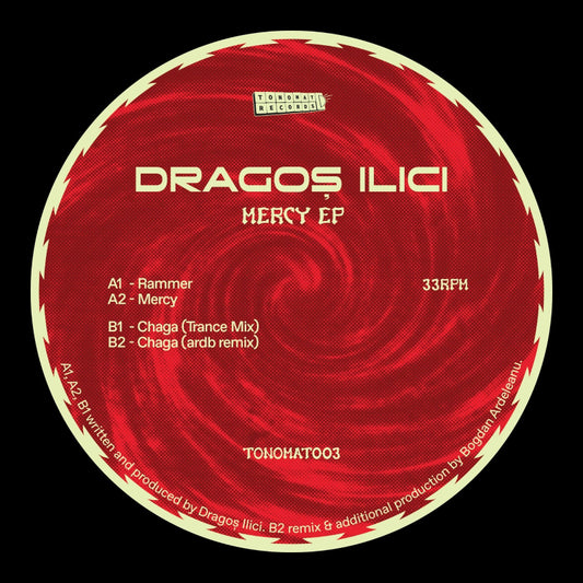 Red vinyl record with white text displaying album details and tracklist on a black background