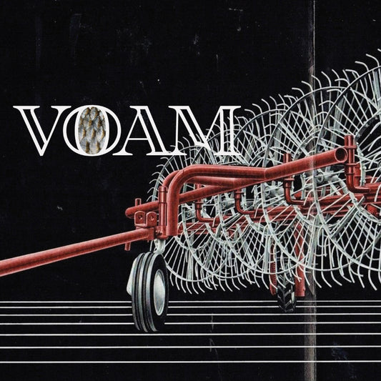 Red agricultural implement with 'VOAM' branding on a black background