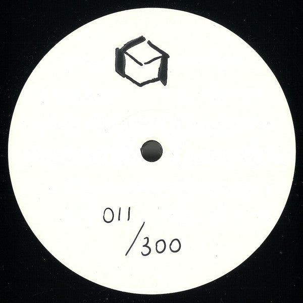 White circular label with black text and symbol on a black background
