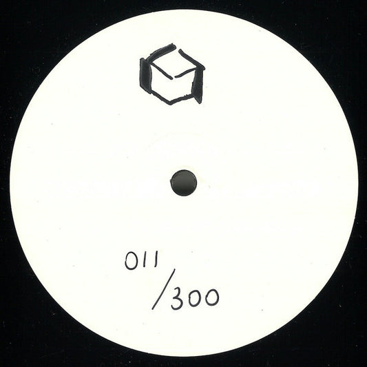 White circular label with black text and symbol on a black background