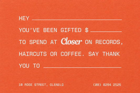 A retro-style orange gift card with white text reading 'HEY YOU'VE BEEN GIFTED $ TO SPEND AT Closer ON RECORDS, HAIRCUTS OR COFFEE. SAY THANK YOU TO' with blank lines, plus the address '(08) 8294 2525' at the bottom.